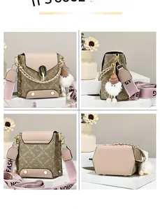 Detailed views of pink leather and monogram crossbody bag with wide fashion strap