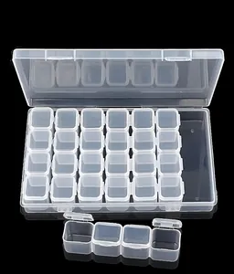 Detailed view of 28-slot transparent plastic nail art storage box with removable inner cases