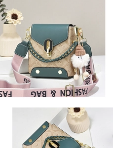 Detail of crossbody bag with beige monogram pattern, green flap and wide fabric strap