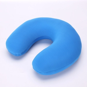 Detail of blue U-shaped travel neck pillow made with soft knitted plush fabric texture