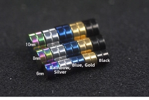 Magnetic stud earrings in five colors and three sizes shown on a black background
