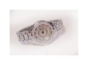 Macro shot of silver-tone ladies' watch encrusted with brilliant crystals and link bracelet