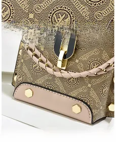 Detail view of Oumifer crossbody bag with high-quality textured fabric and metal studs