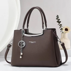 Classic dark brown pebble leather tote bag with silver U-shaped handles and strap