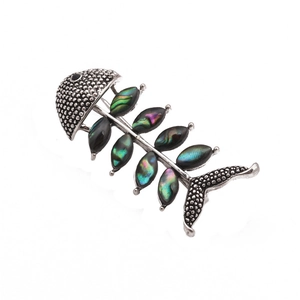 Handcrafted vintage silver fishbone brooch with iridescent abalone shell inlay