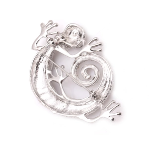 Detailed back view of the silver lizard brooch showing the pin mechanism and metal texture