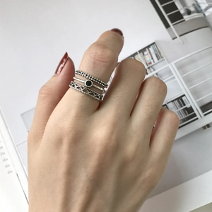 Set of three vintage 925 sterling silver rings with black resin stone and wave patterns