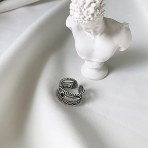 Close-up of vintage 925 sterling silver ring with black agate and S925 hallmark stamp
