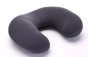 Detail of dark grey travel U-shaped neck pillow showing smooth knitted fabric and stitching