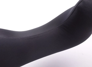 Detailed flat seam stitching on black high-density elastic fabric of a U-shaped travel pillow
