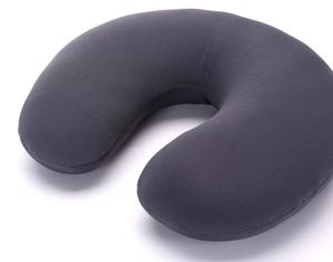 Macro shot of charcoal grey U-shaped travel pillow with premium knit fabric and smooth seams