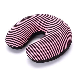 Close-up of pink and black striped U-shaped travel neck pillow with soft knitted texture