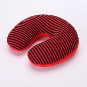 Detailed view of red and black striped U-shaped travel neck pillow with knit fabric texture