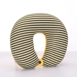Close-up of green and white striped U-shaped neck pillow with soft yellow lining and black buckle