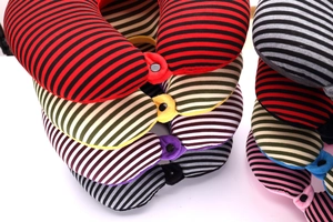Close-up of colorful striped U-shaped neck pillows with secure front buckle fastening