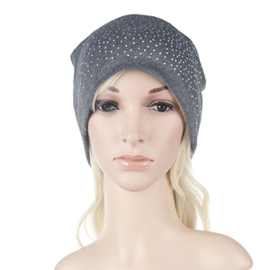 Detailed close-up of dark grey knitted beanie featuring sparkling silver rhinestone accents