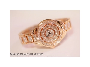 Detailed close-up of rose gold luxury watch featuring full crystal pavé on dial and band