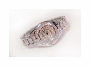 Macro shot of silver crystal-encrusted watch dial with polished metal textures