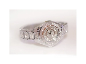 Detailed view of women's silver fashion watch featuring full crystal encrusted dial and band