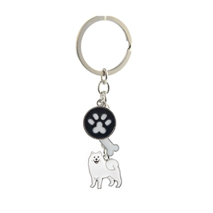Detail of silver pet keychain featuring Samoyed dog, paw print and bone charms