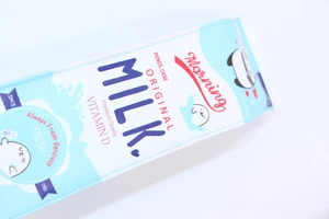 Detailed macro view of the cute milk box cartoon pencil case printing and texture