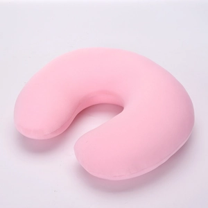 Top view of pink plush travel U-shaped neck pillow with soft skin-friendly fabric texture