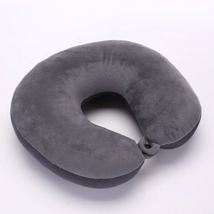 Close-up of soft gray plush fabric and adjustable buckle on the U-shaped travel neck pillow
