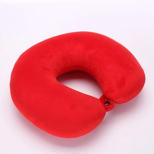 Close-up of red plush travel U-shape neck pillow with secure black snap button fastener