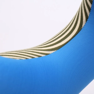 Detailed close-up of blue and green striped fabric texture on a soft neck pillow