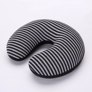 Detail of ergonomic black and grey striped U-shaped travel neck pillow in soft plush fabric