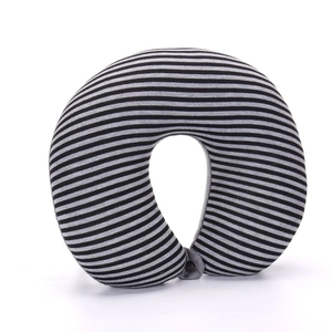 Detail of striped U-shaped travel neck pillow with soft fabric and snap button closure