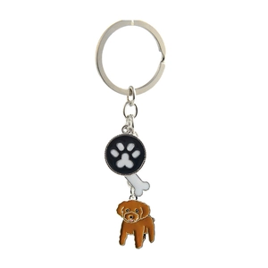 Detail of dog keychain with poodle charm bone pendant and black paw print ornament