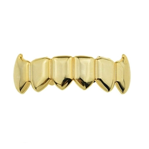 Macro shot of hip hop vampire fangs gold grillz with polished six-tooth design
