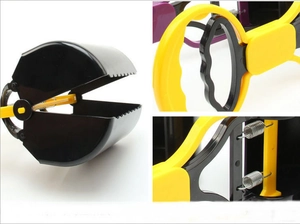 Macro detail of portable pet pooper scooper with heavy-duty springs and serrated teeth
