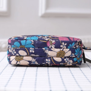Three-layer floral canvas clutch with triple zippers for organized storage and high capacity