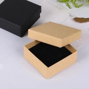 Detail of square kraft paper jewelry boxes with black foam inserts for rings and earrings