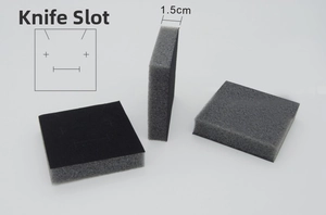 Detail view of 1.5cm thick black flocked sponge insert with die-cut slots for jewelry boxes