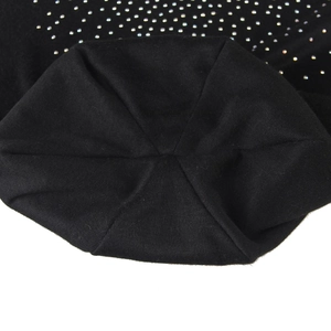 Close-up of black knitted beanie top featuring premium silver rhinestone embellishments