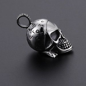Vintage silver skull pendant necklace with intricate engraved patterns in punk style