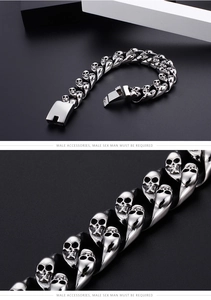 Macro view of punk style stainless steel skull link bracelet with secure clasp closure