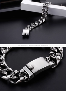 Macro detail of silver skull link bracelet with sturdy metal clasp for men