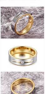 Macro detail of two-tone tungsten ring with silver brushed finish and gold inner band