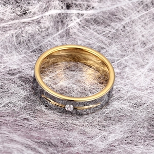 Two-tone tungsten steel ring with silver brushed finish and gold inner band and crystal