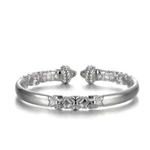 Close-up of vintage engraved silver pumpkin head bangle with 18K white gold finish
