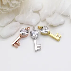 14K gold heart key pendant set in rose gold, silver, and gold colors with zircon stones