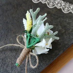 White calla lily and flocked antler wedding boutonniere with rustic twine wrapped handle
