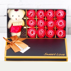 Detail of 12 red soap roses and a plush bear in a black Sweet Love gift box for girls