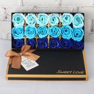 Detail of 18 blue gradient soap roses in a luxury black gift box with gold trim