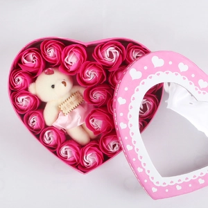 Detailed heart-shaped pink gift box with soap roses and a small plush bear inside
