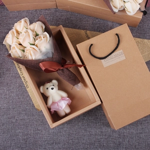 Gift set featuring champagne soap roses, a teddy bear, and a premium brown paper gift box